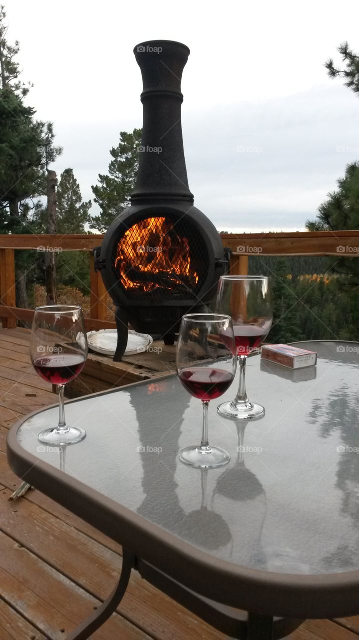 Deck Time. Relaxing on the deck of my Colorado cabin in front of a fire with wine