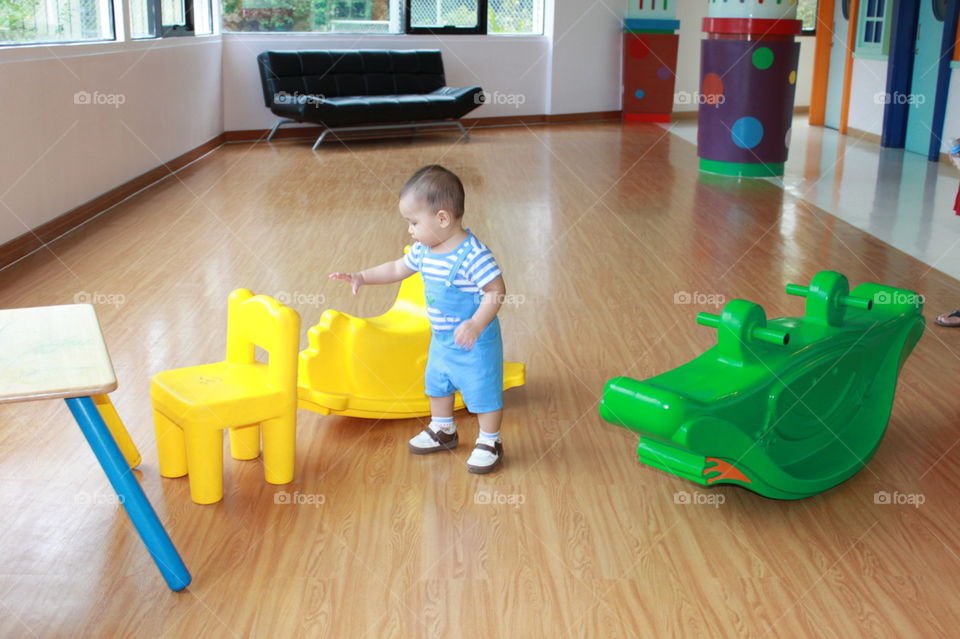 Yellow seat. kid at the playground