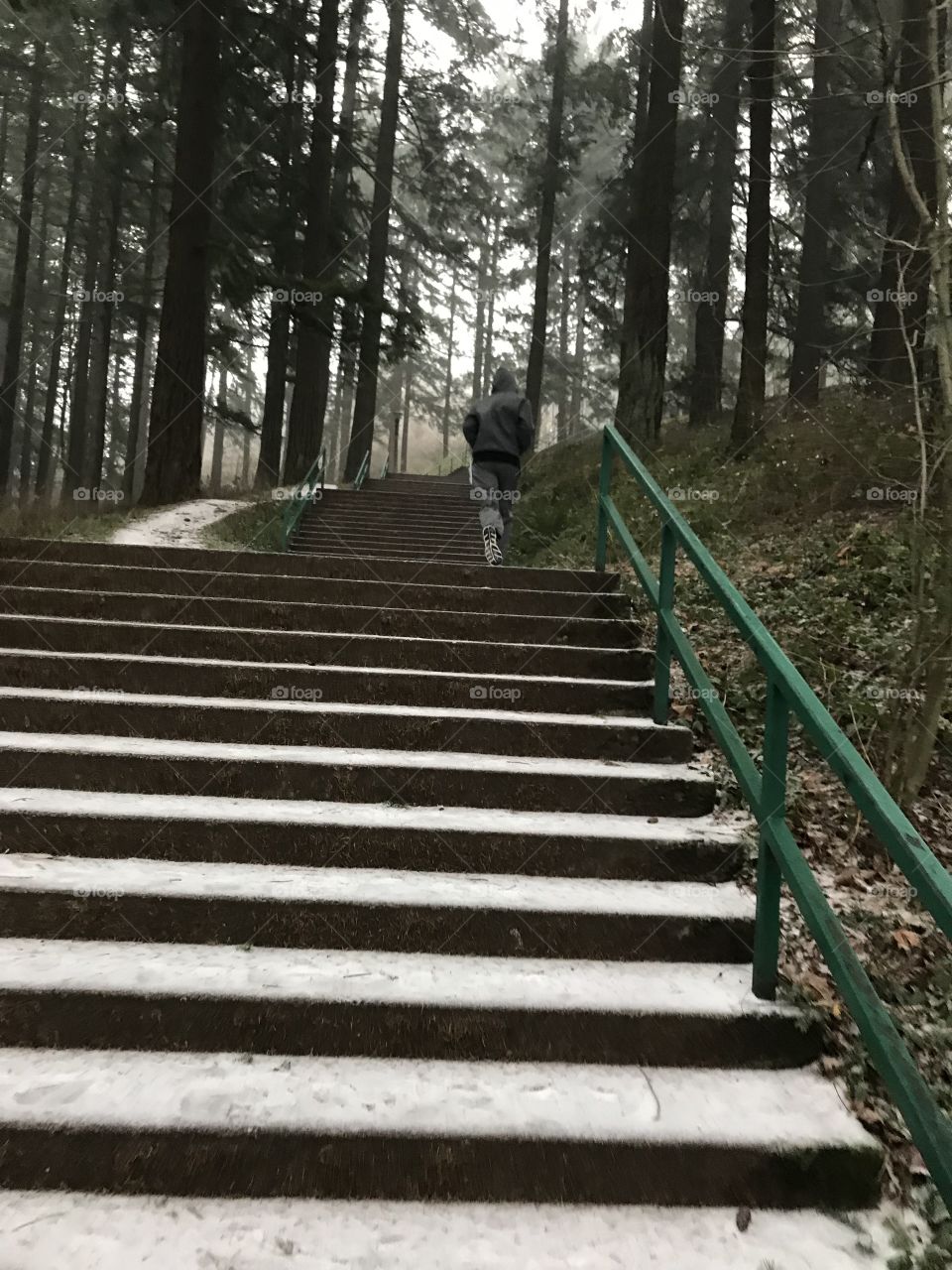 Running up the snow covered steep steps. 