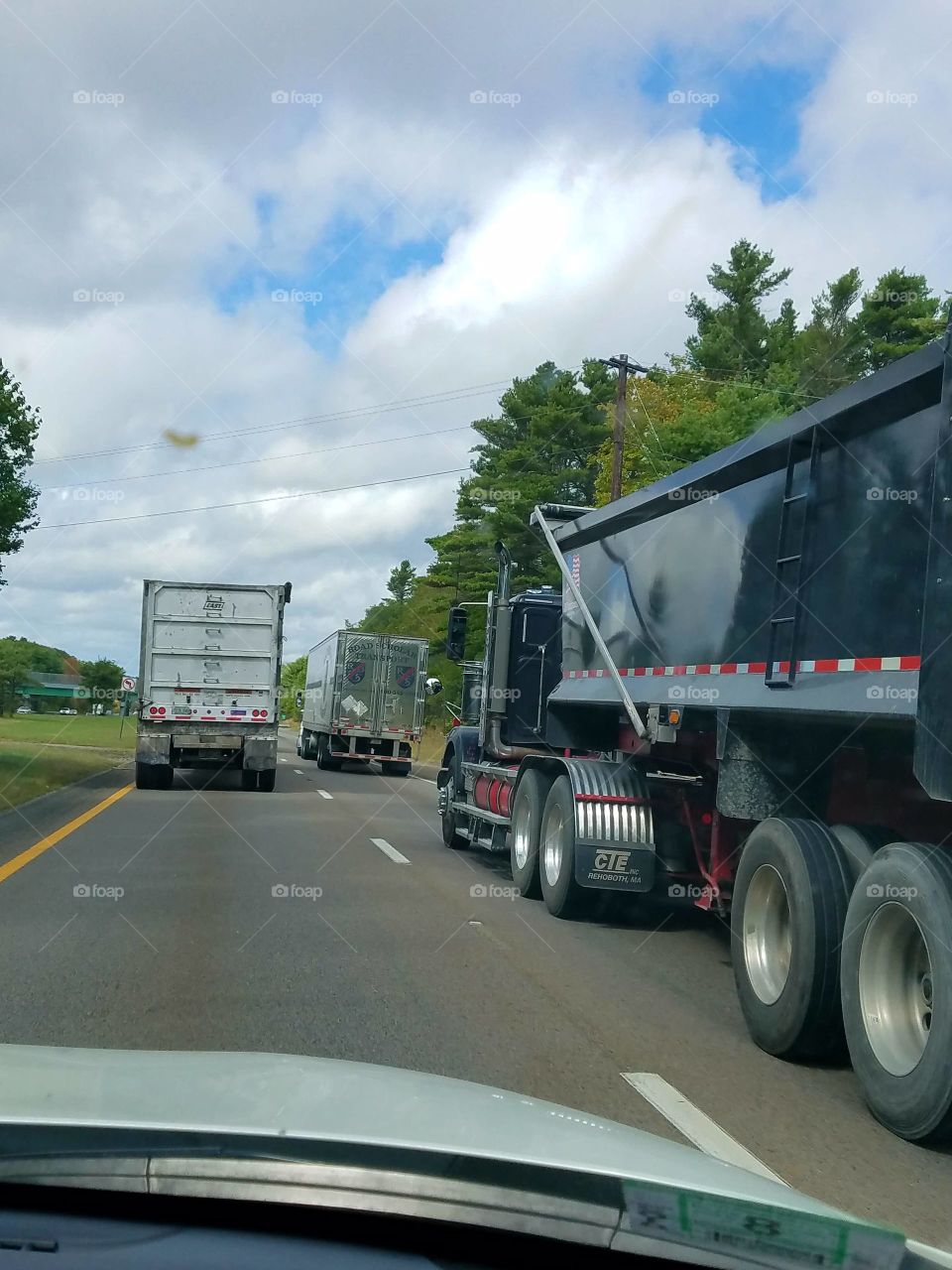 Hoping to pass these big rig trucks.