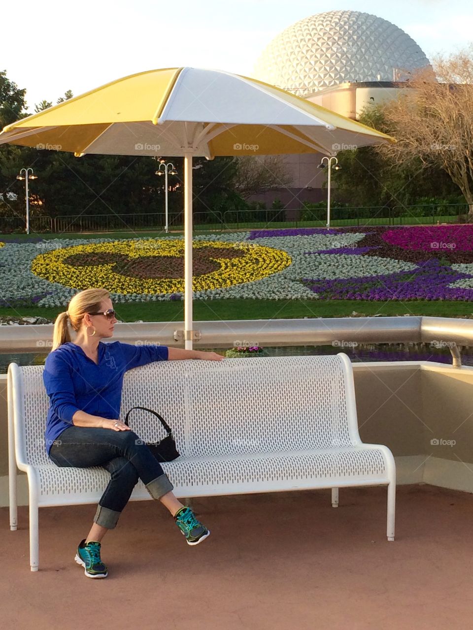 Woman relaxing at Walt Disney World’s  Epcot Center. 