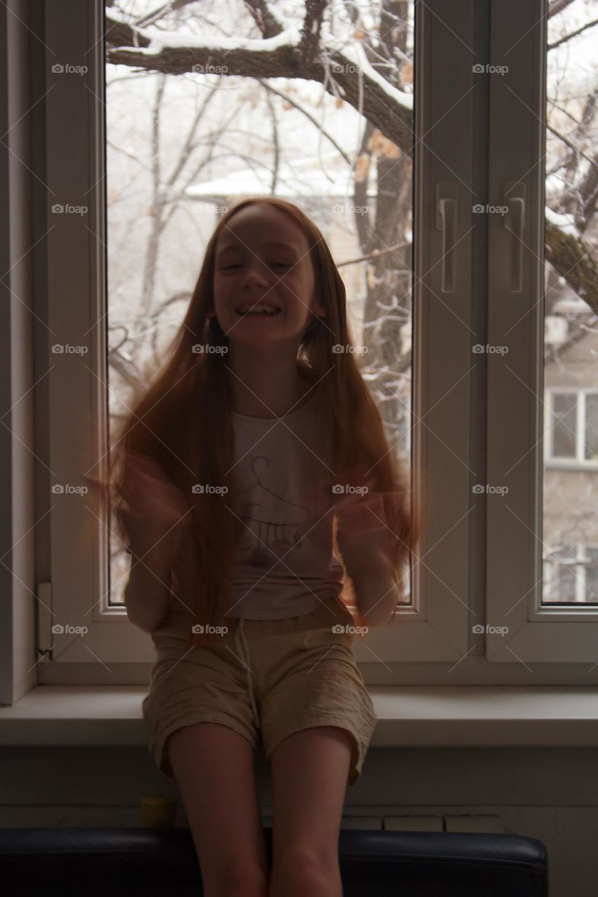 Girl near the window