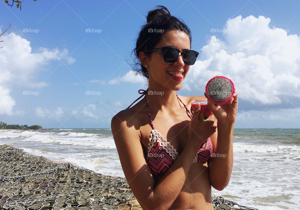 Young woman with dragonfruit