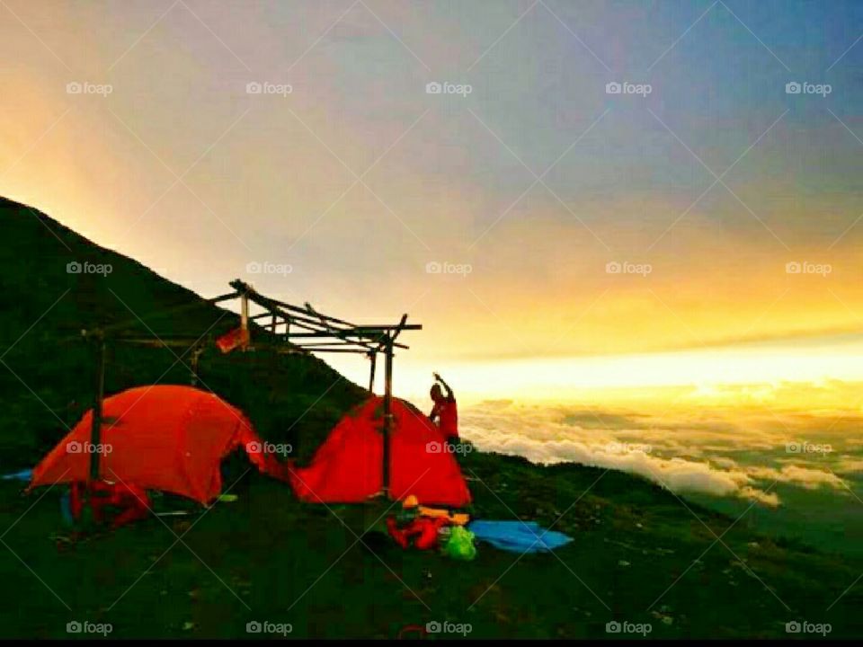 people go for a walk to make a camp on a mountain
