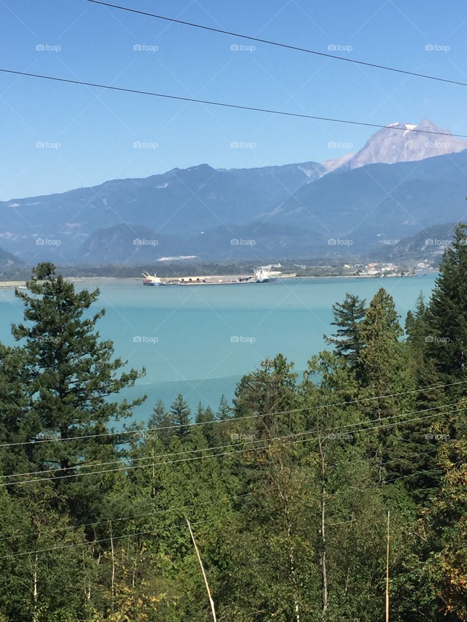 View of the Squamish port from the Sea to Sky Highway; a stunning gradient of different tints of ocean blue!