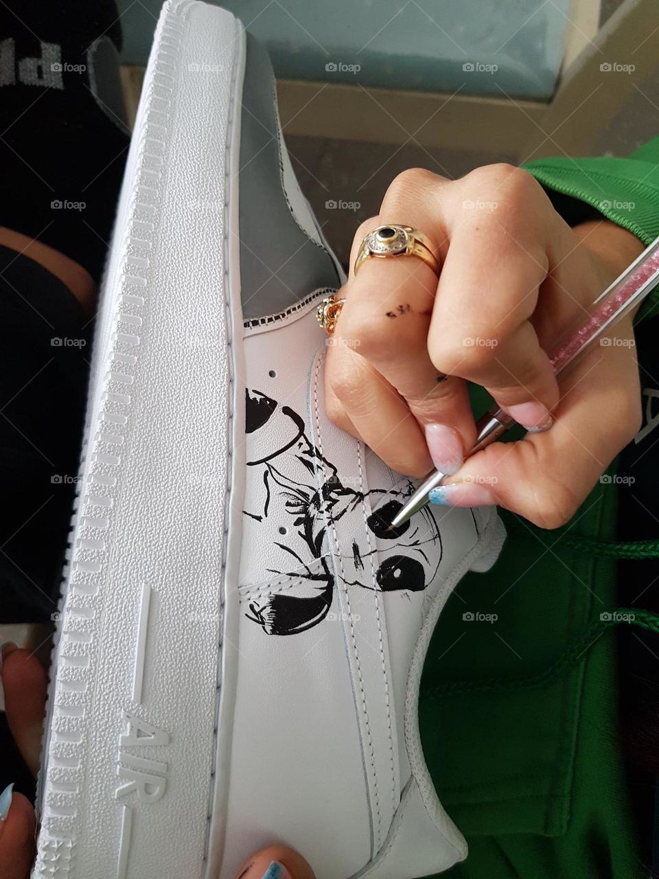 Woman is making her running shoes unique