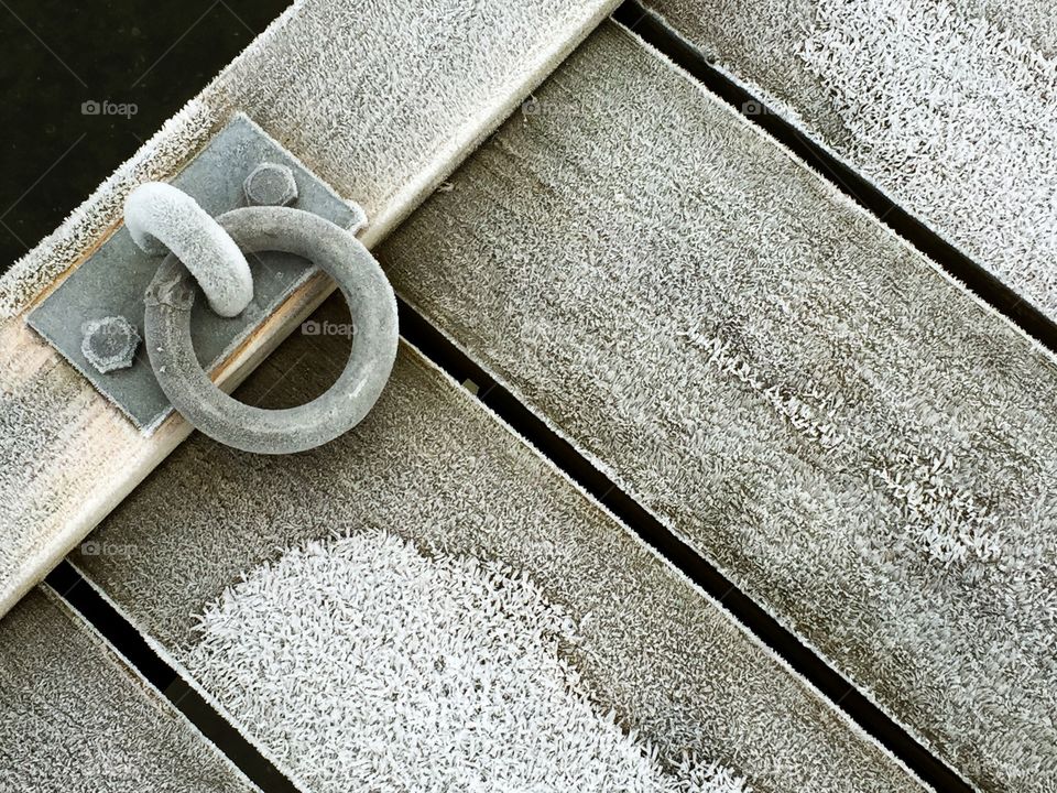 Close-up of wooden jetty at frozen