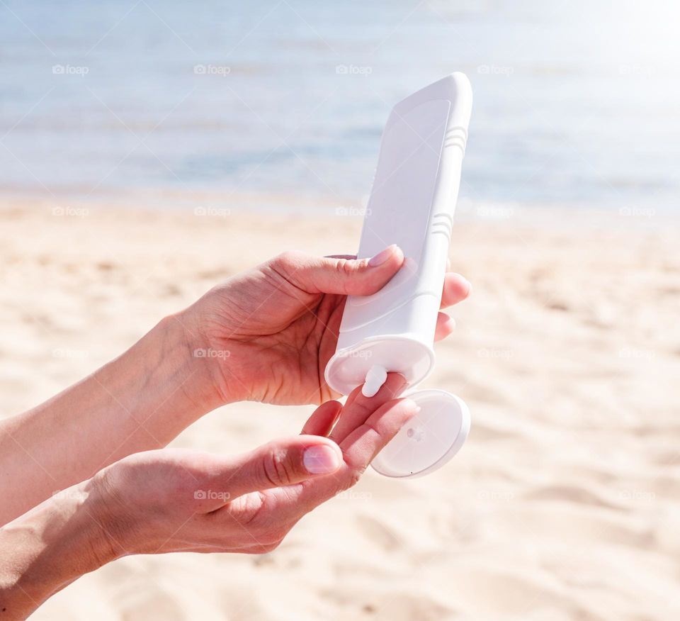 woman hand holding beauty products