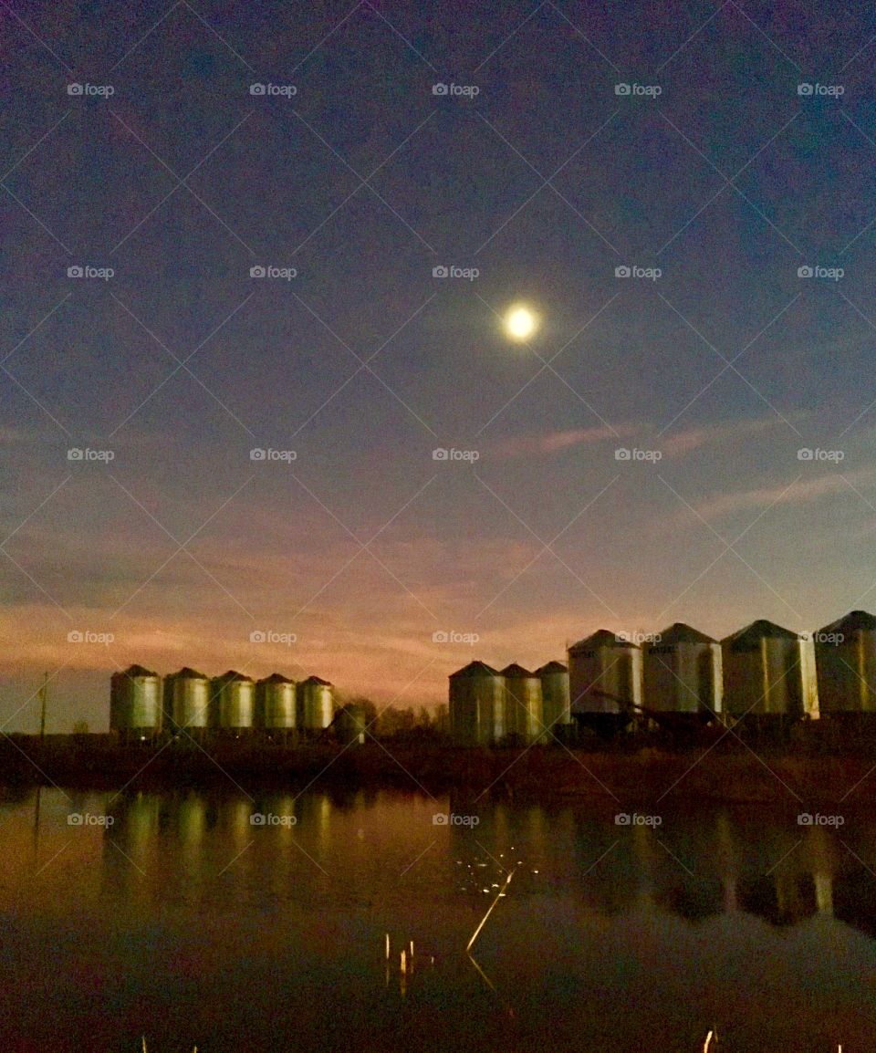 Grain bins in the moonlight