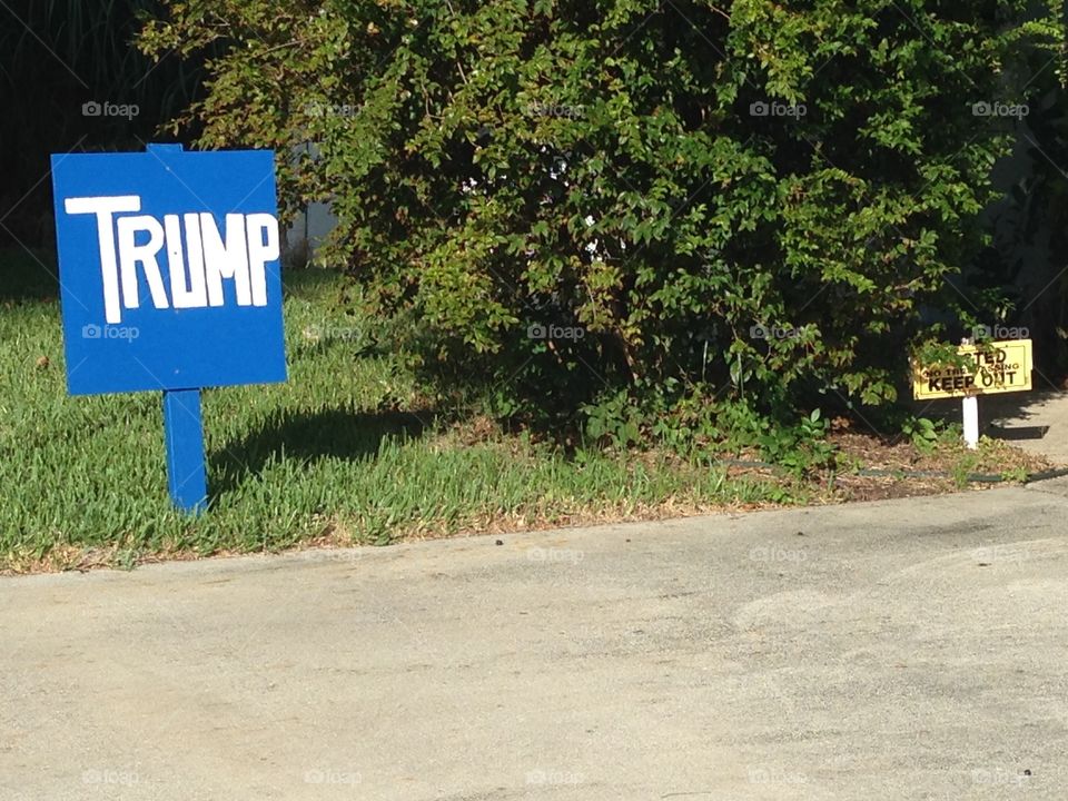 Trump supporter with a KEEP OUT sign