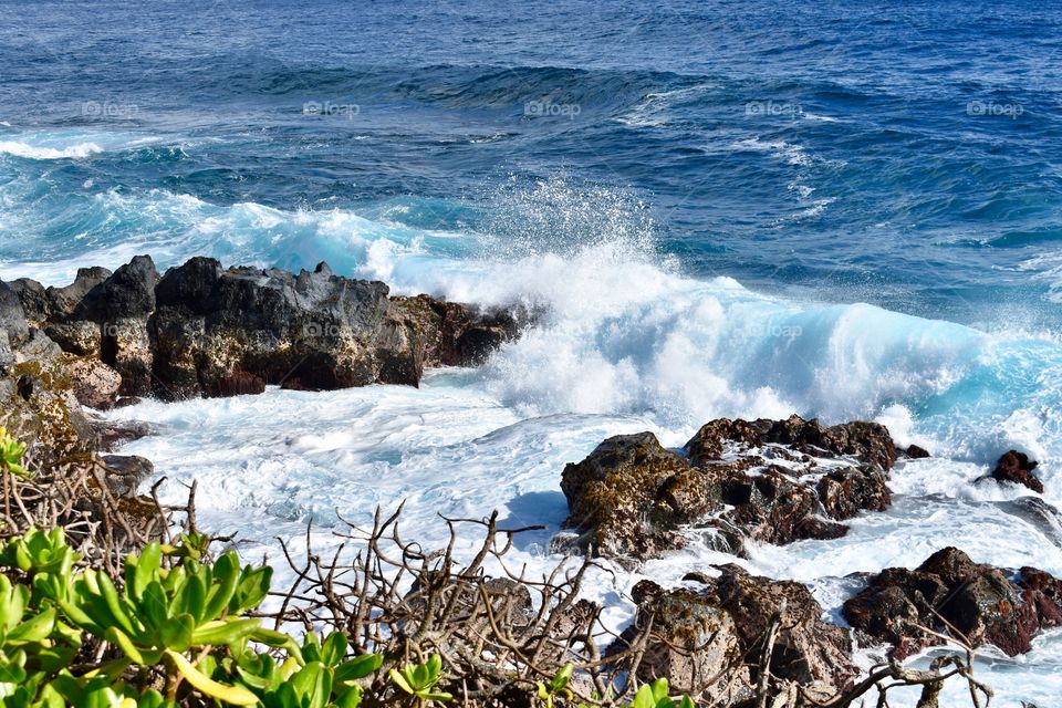 Watching the waves by the sea cliffs