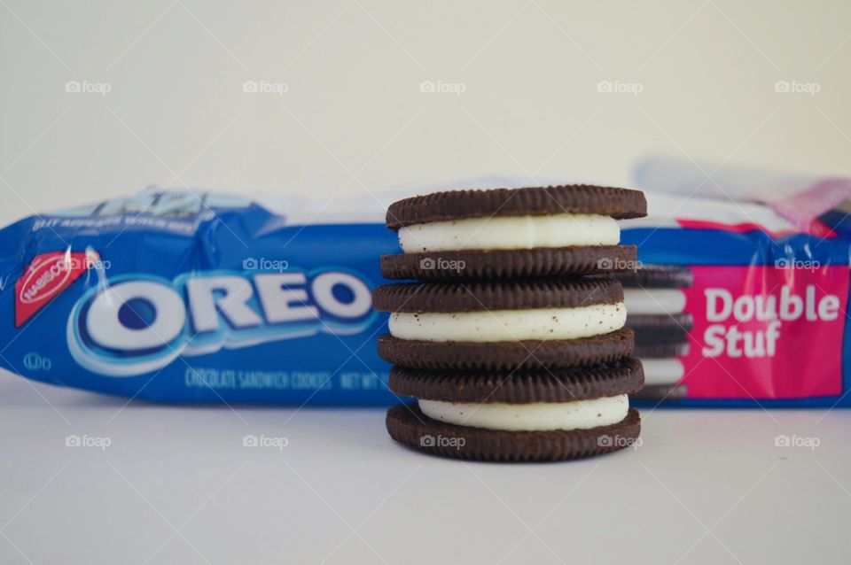 Double stuff Oreo cookies stacked in front of the package