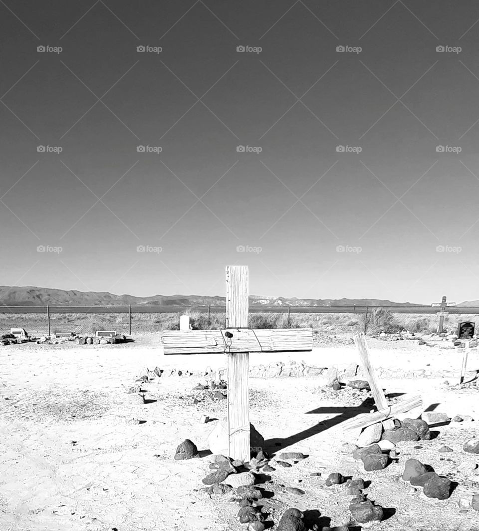 a small old cemetery some graves with only wooden crosses in Armagosa Valley Death Valley Junction