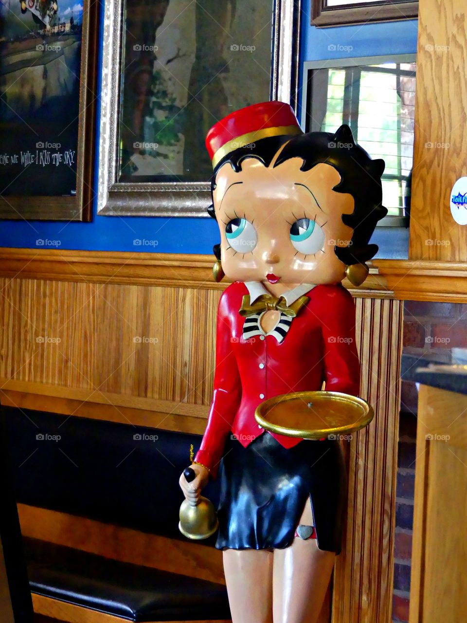 Color Red - Betty Boop statue in a restaurant. She was the first character on the animation screen to represent a sexual woman.