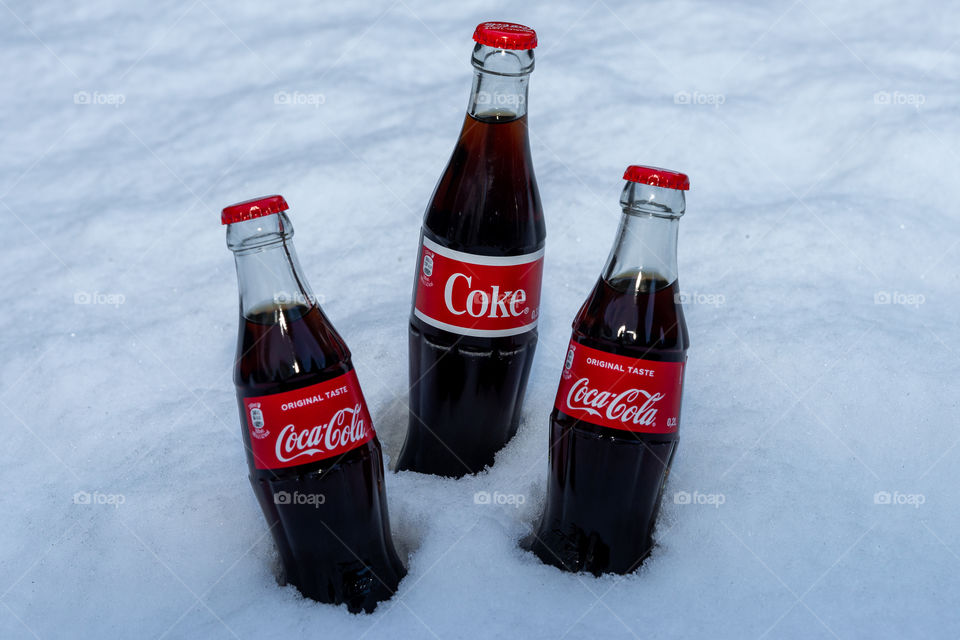 Coca Cola bottles in snow
