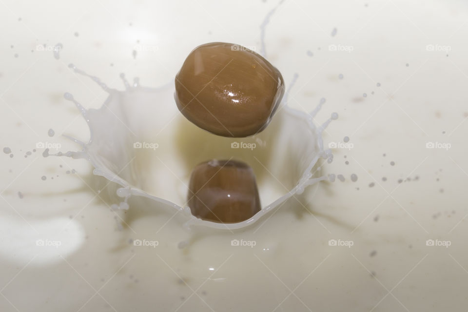 Chocolate milk splash. chocolate candy and milk.