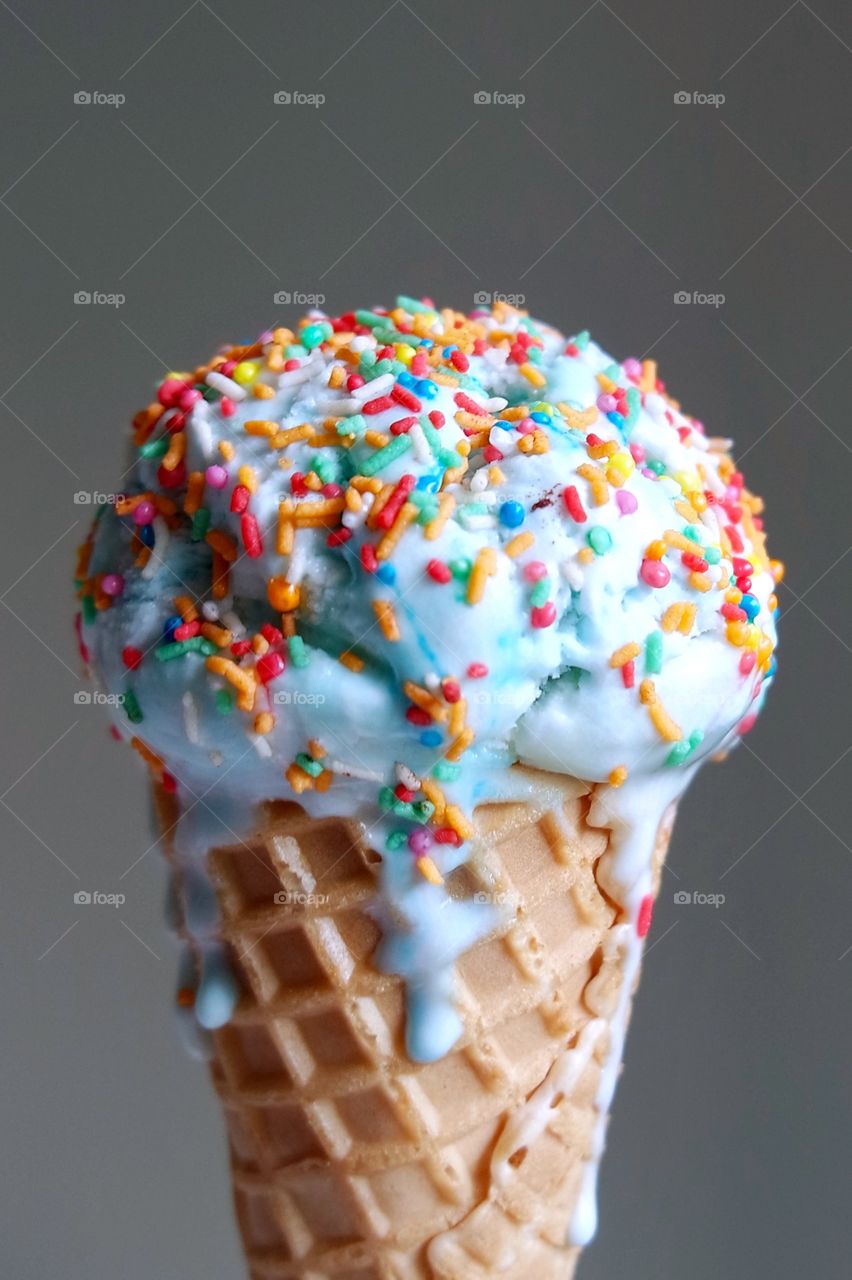 Close-up of melting ice cream cone