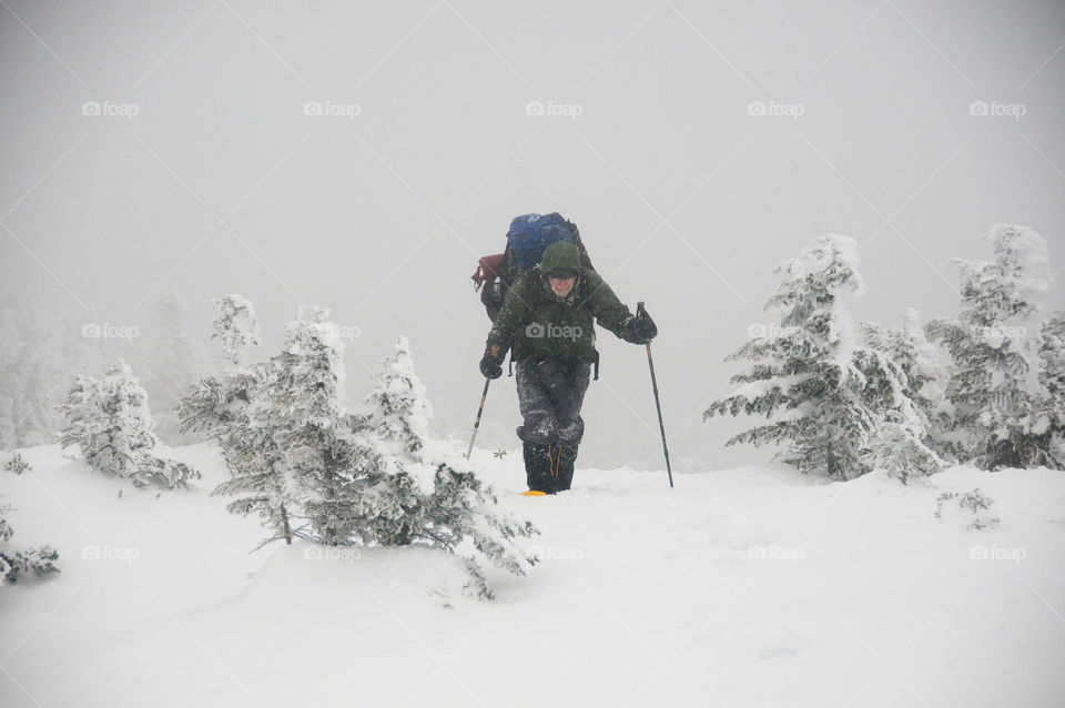 Snowshoeing on a high mountain peak in the winter