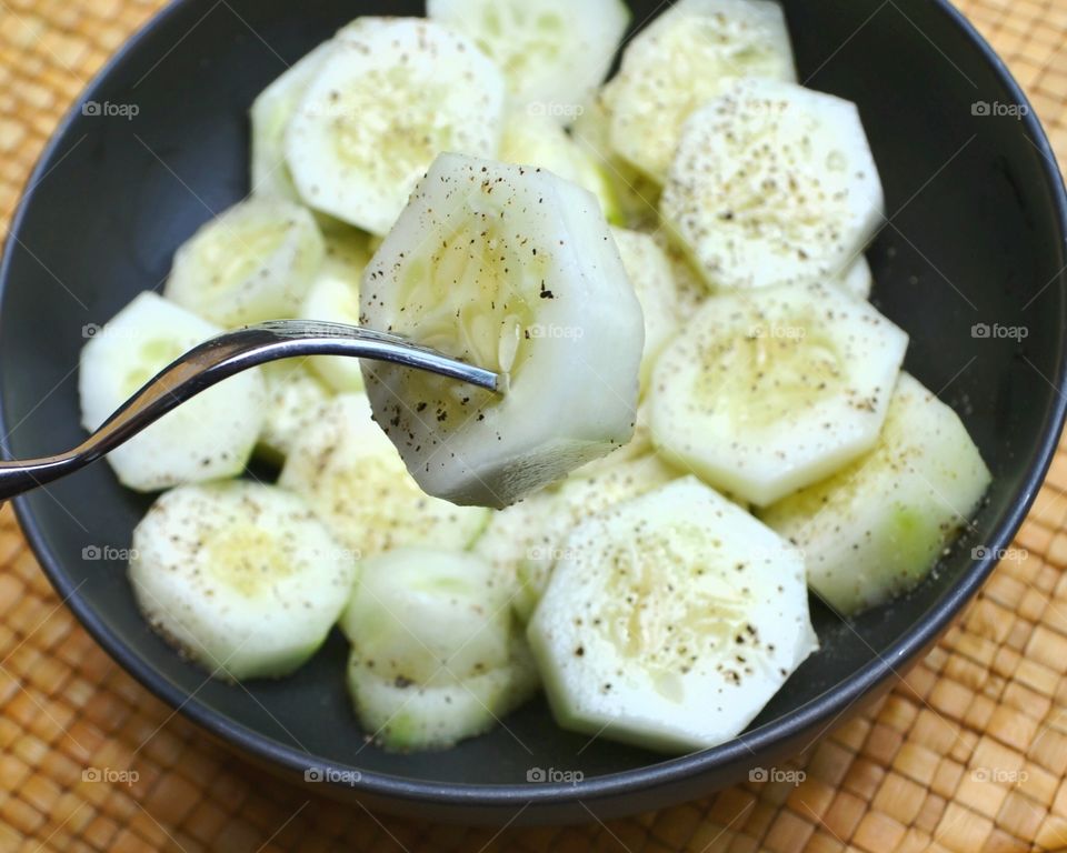 cucumber salad. sliced cucumbers with ground pepper refreshing