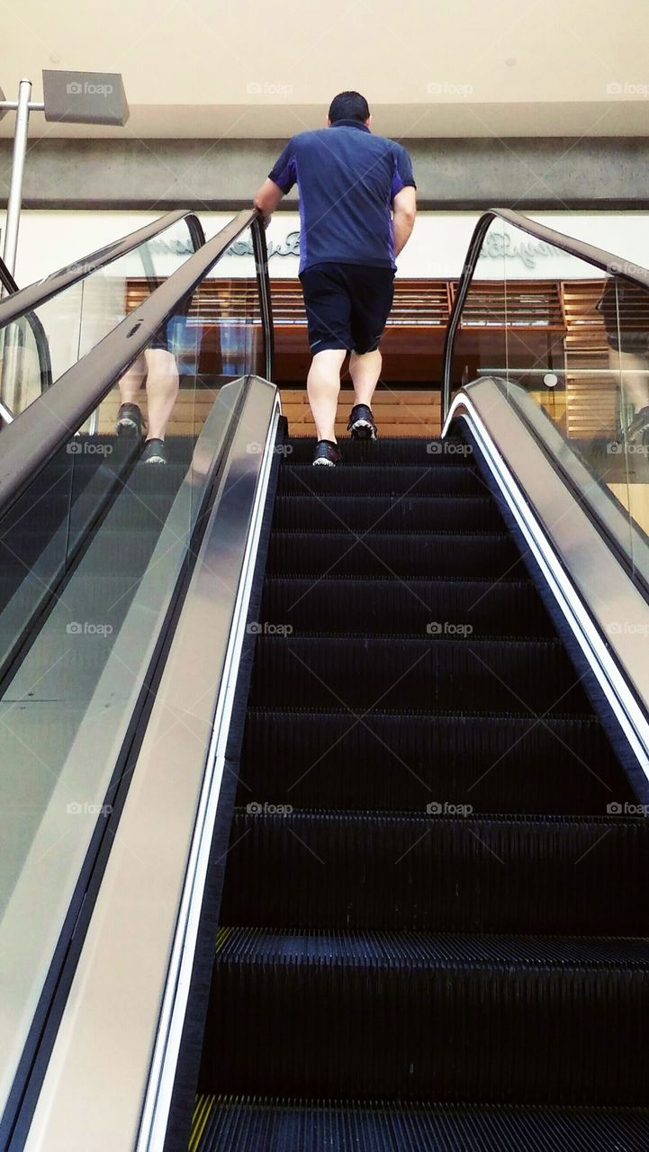 Man on Escalator