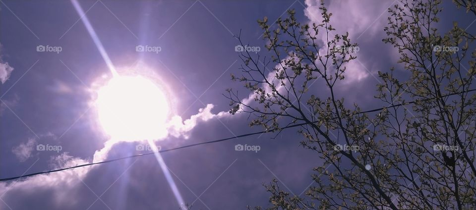 Sun Shining Behind The Cloud