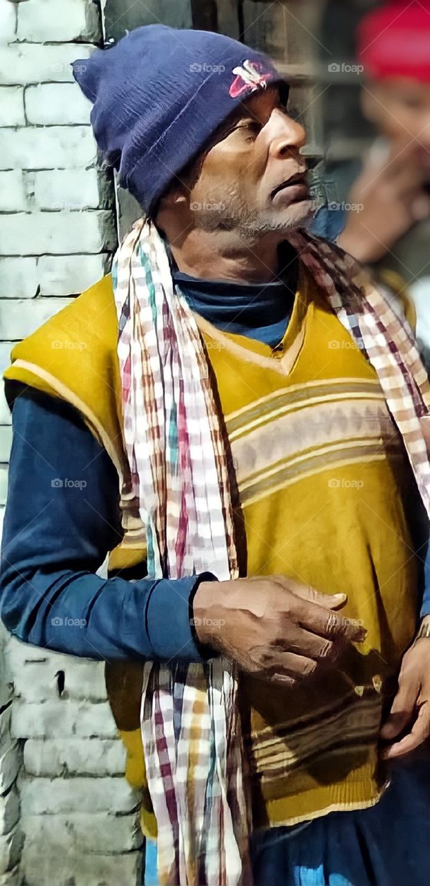 Old man in a sweater and hat