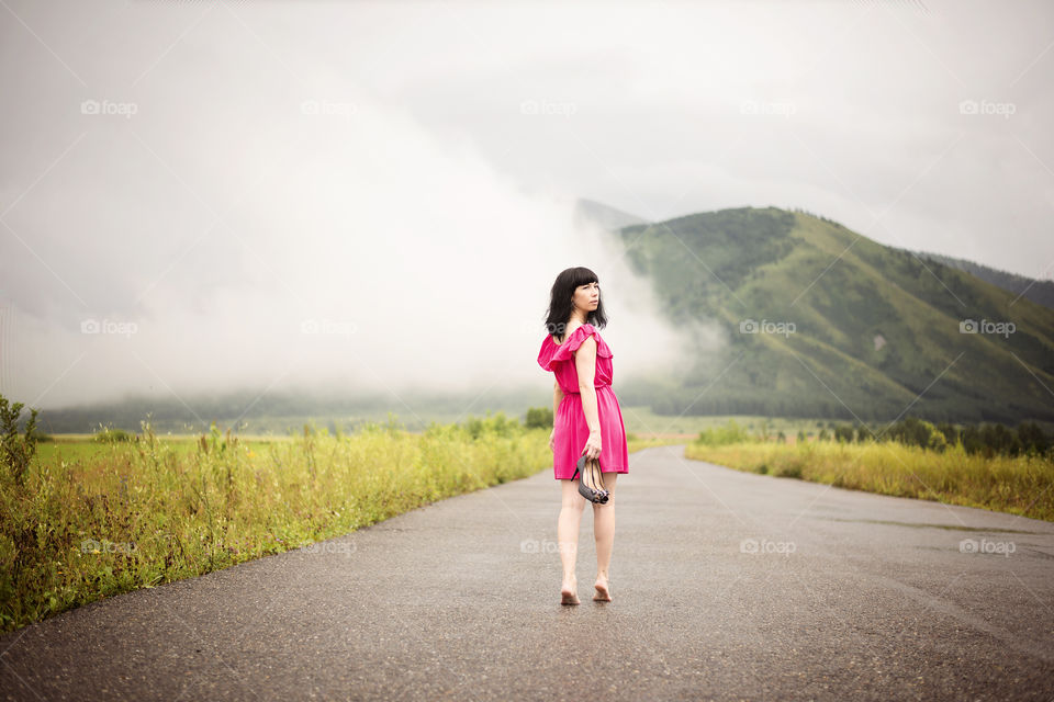 Pretty woman walking on road