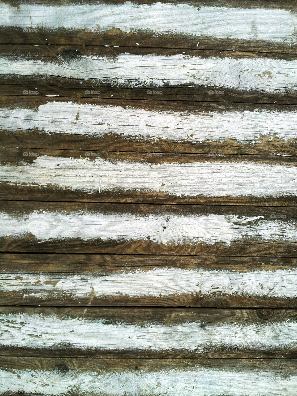 White faded paint lines on wood