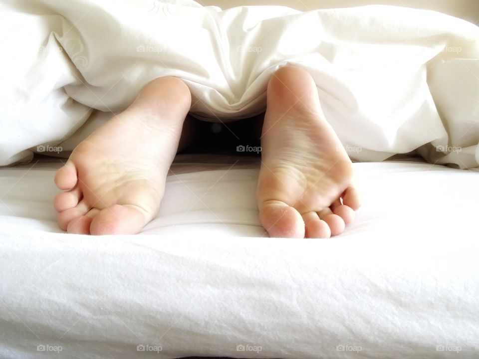 Feet in bed