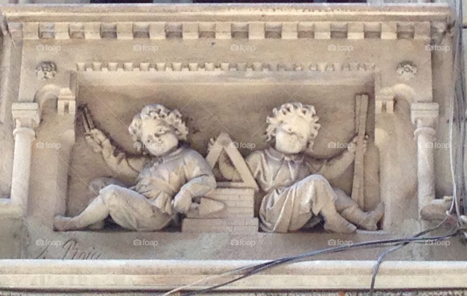 Cherubs. Architecture cherubim marble bad relief sculpture Barcelona travel stone 