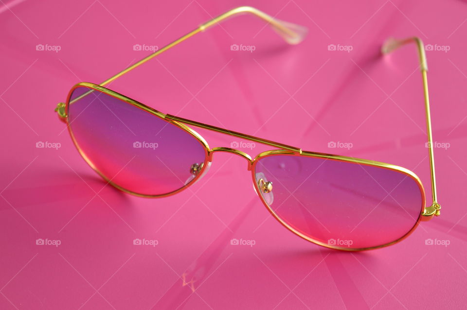 Sunglasses on pink backgrounds