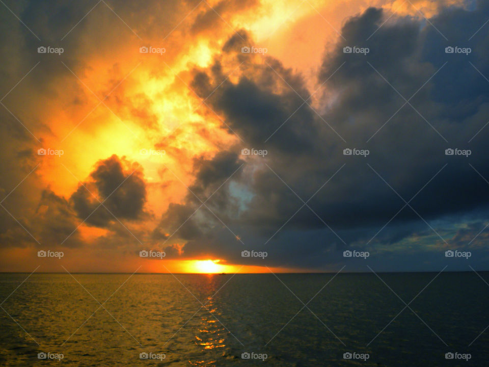 huahine sunset stormy by drewadams