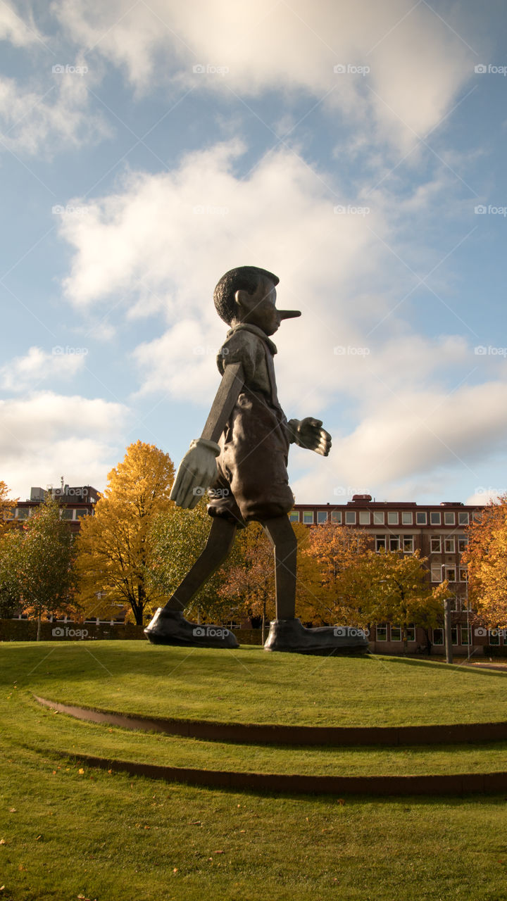 giant statue of Pinocchio walking into the city of Borås Sweden