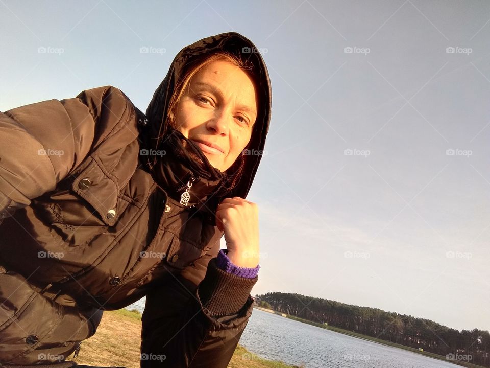 selfie girl on the nature lake shore view