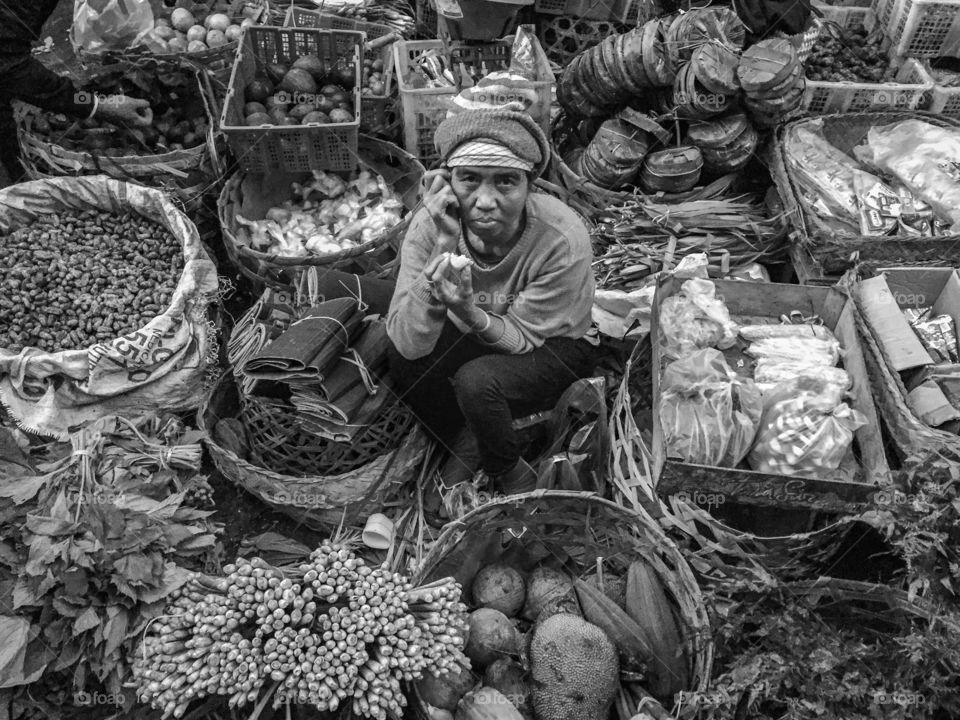 Woman are waiting to sell fresh food in the local market 