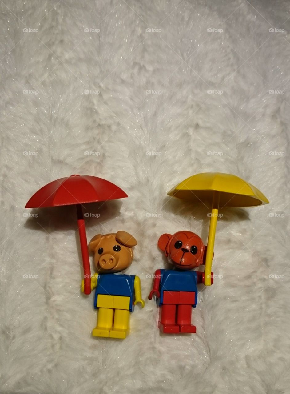 Old lego animals with umbrellas