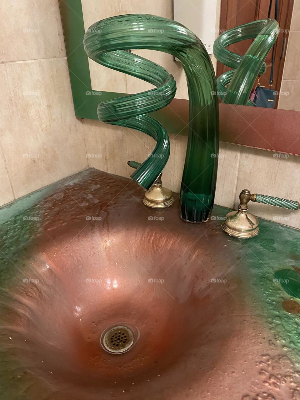 Glass waterfall tap, isn’t that unique 