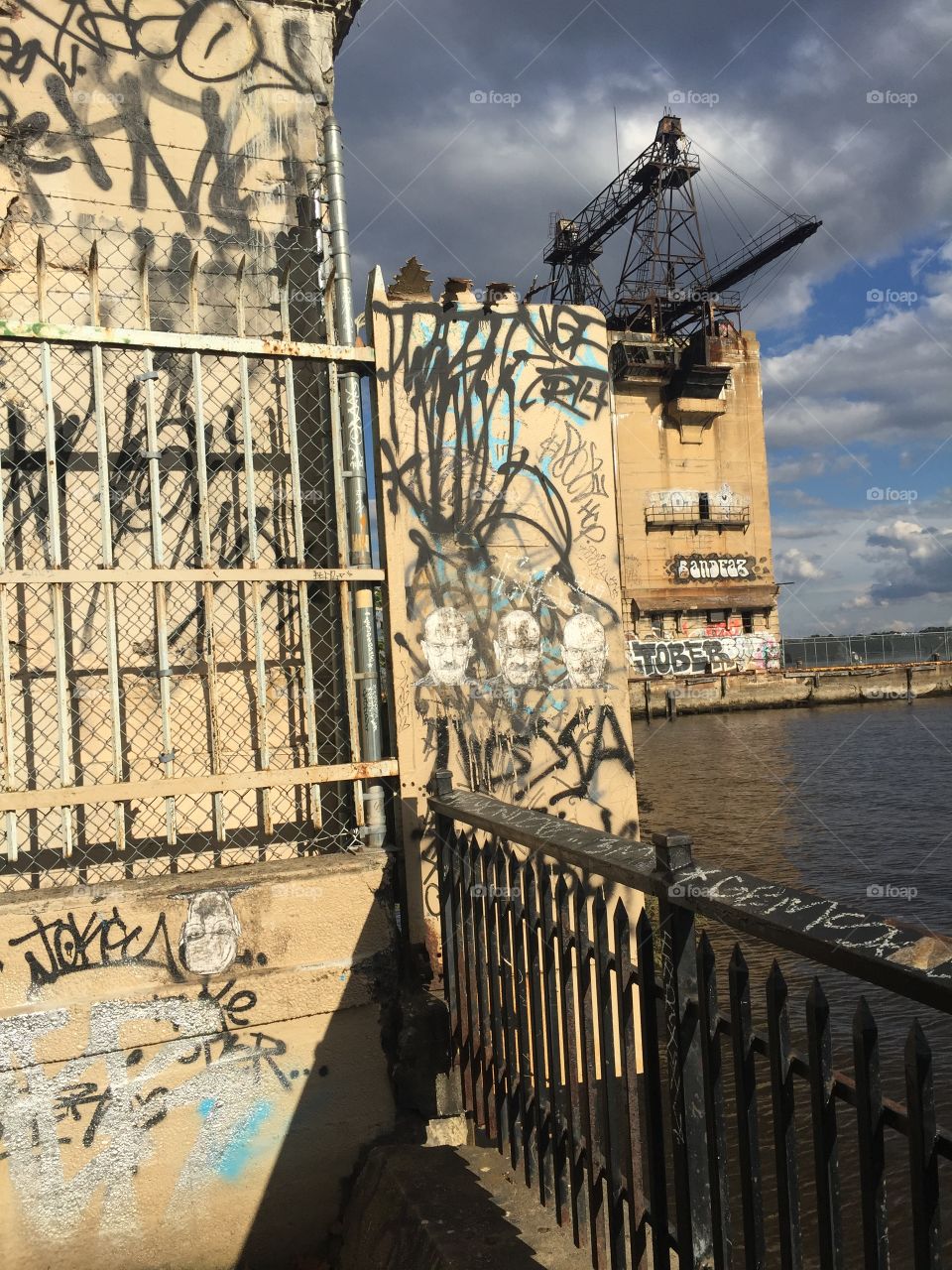 October skies abandon buildings with graffiti overlooking the river..