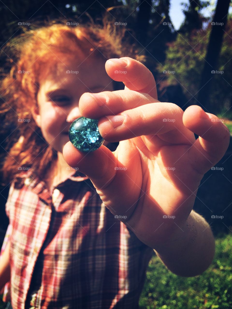 Treasure Find. Redhead with blue marble
