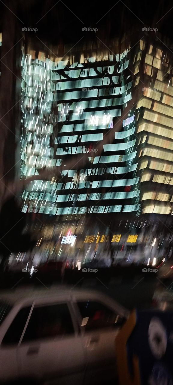 A mall tower in a crowded street