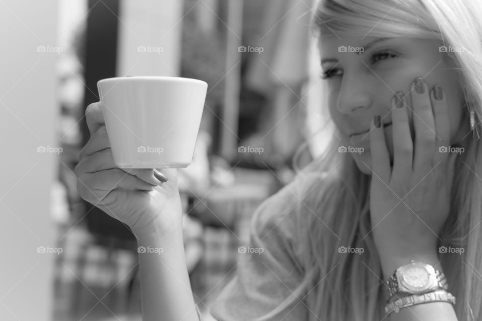 Close-up of a woman with tea cup