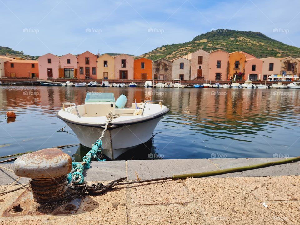 small boat moored in the splendid pier of Bosa in Sardinia