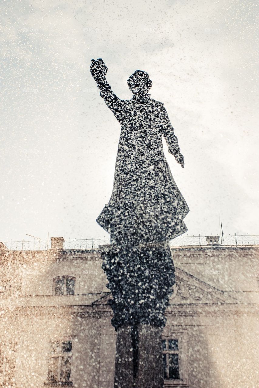 Monument in curtain of droplets