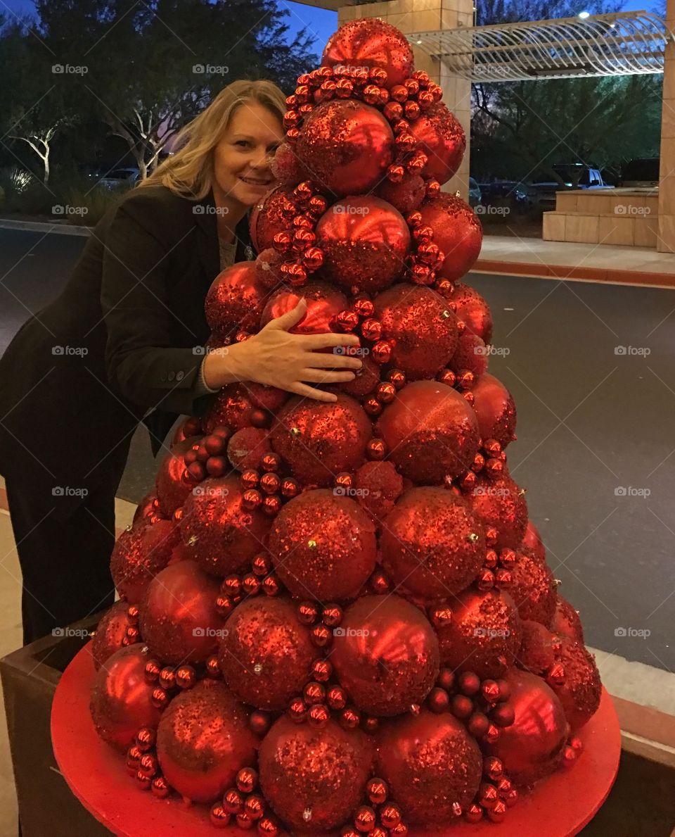 Woman standing near christmas decoration