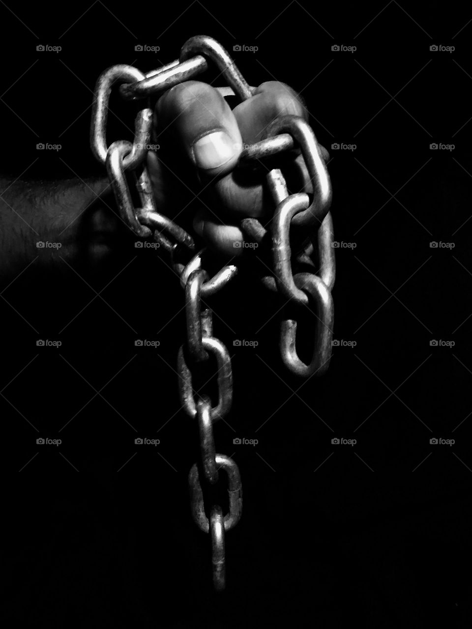 Studio shot of a person holding chain