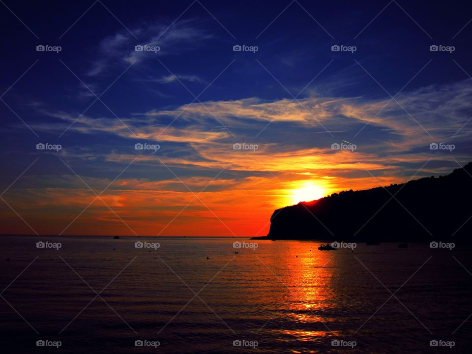 Sunset over Praia beach ( Italy ).