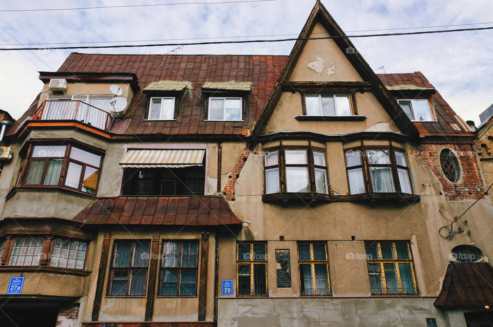 Urban city life. View Of the street, road, buildings in Kharkiv, Ukraine. Retro and vintage architecture.