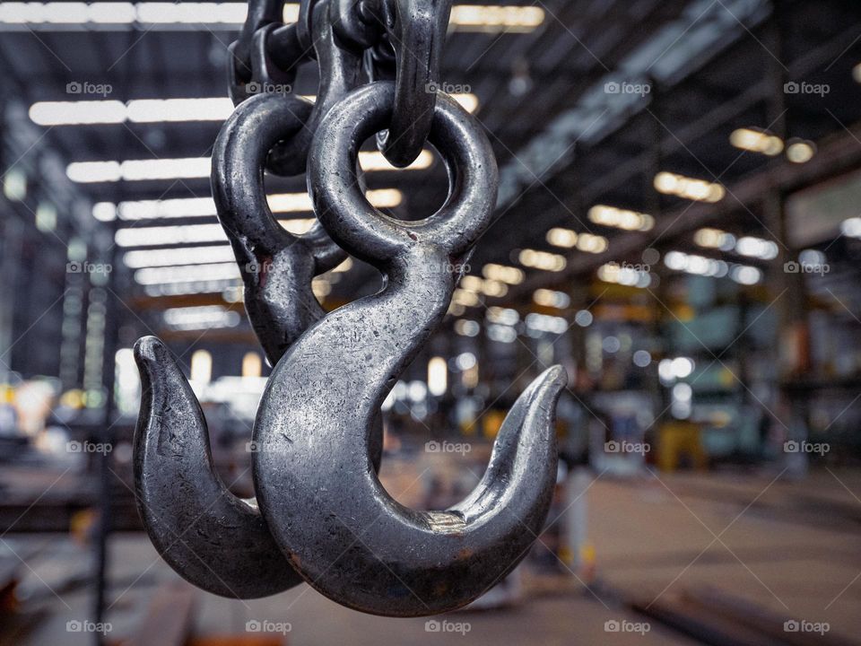 Close-up of heavy duty steel hooks in a factory