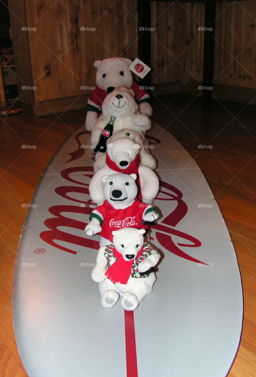 all bears surfing on Coca-Cola surfboard