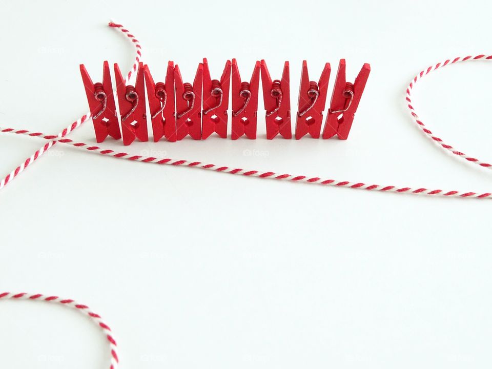Red clothespins in a row